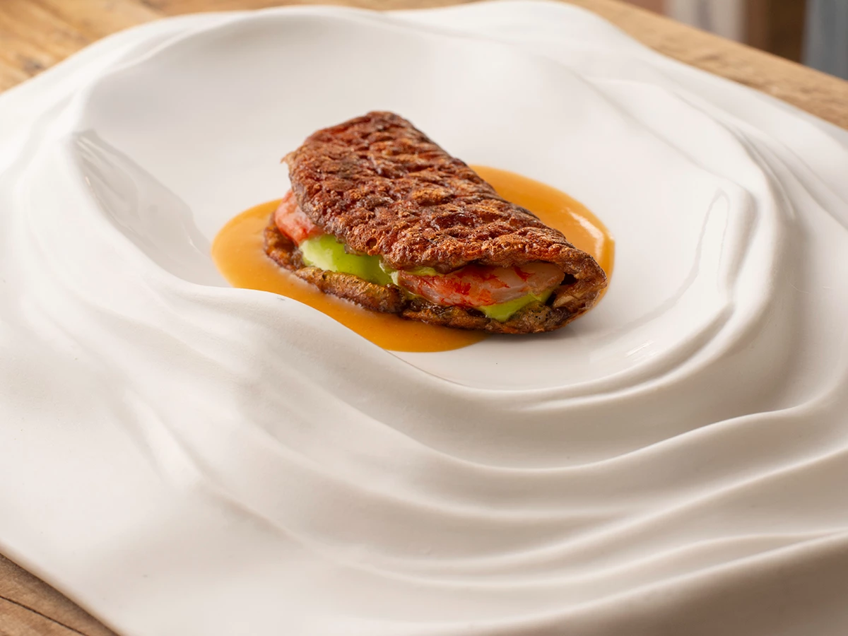Plato de Socarrat de careta de cerdo del restaurante Molino de Alcuenza