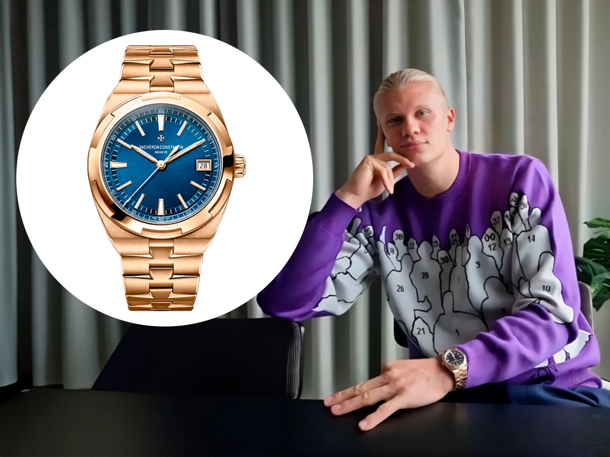 Erling Haaland sentado con un jersey morado y el reloj Vacheron Constantin Overseas en oro rosa con esfera azul.