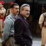Alberto San Juan vestido con traje negro y Mario Casas de militar en una escena de la película La cena.