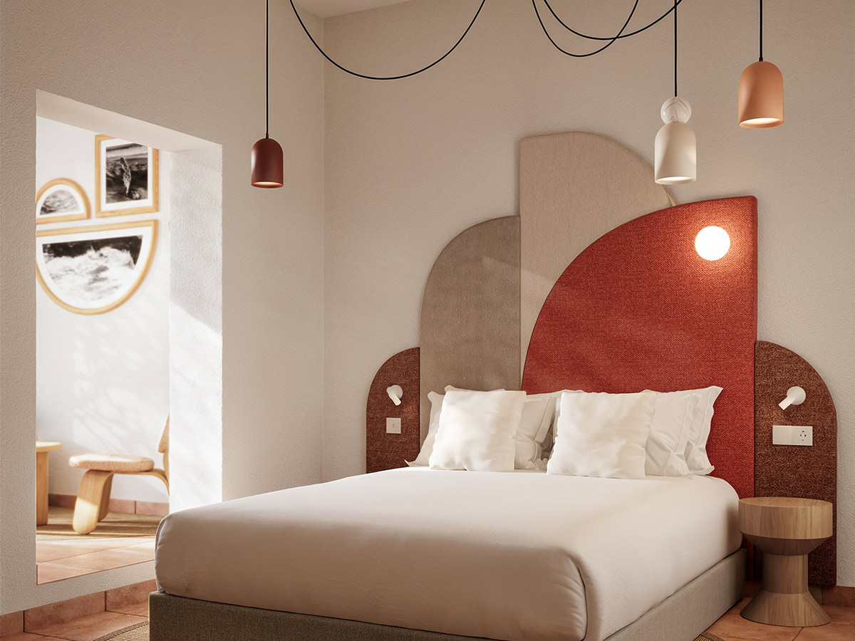 Habitación de One Shot Buenavista en Ibiza con cabecero de geometrías en tonos tierra y salmón