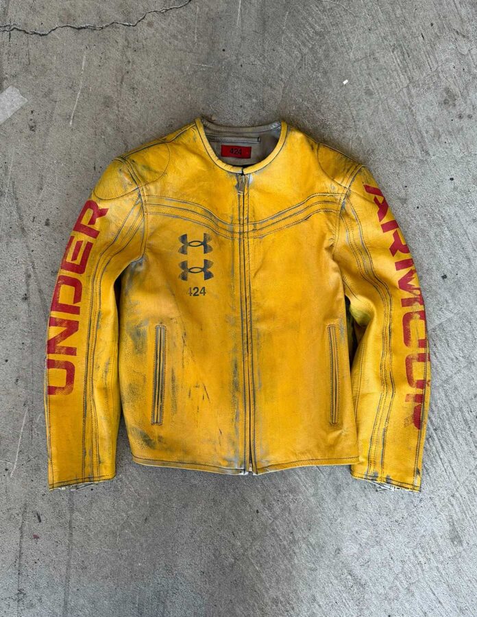 Chaqueta amarilla de cuero de la colaboración Under Armour x 424 de Guillermo Andrade con acabado desgastado